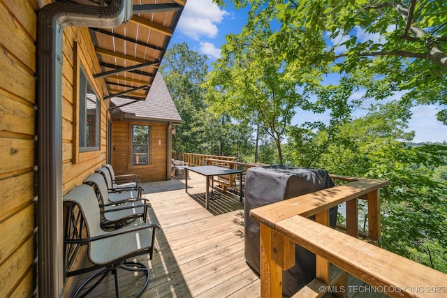 69125 E 252nd Rd, Wyandotte, OK 74370 - wooden terrace with outdoor dining area