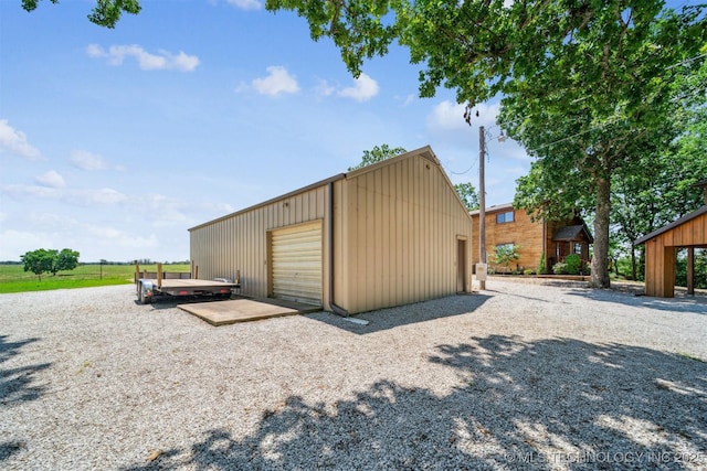 69125 E 252nd Rd, Wyandotte, OK 74370 - view of outdoor structure featuring driveway
