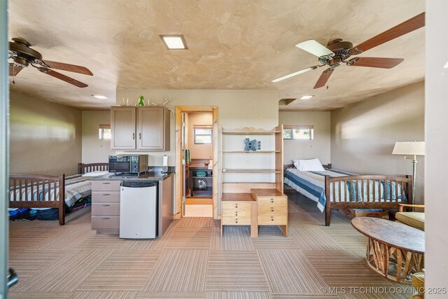 69125 E 252nd Rd, Wyandotte, OK 74370 - kitchen featuring ceiling fan, black microwave, dark countertops, light carpet, and recessed lighting