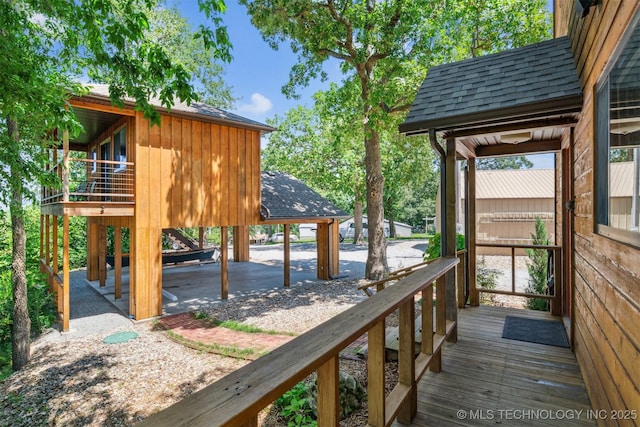 69125 E 252nd Rd, Wyandotte, OK 74370 - wooden terrace with a carport