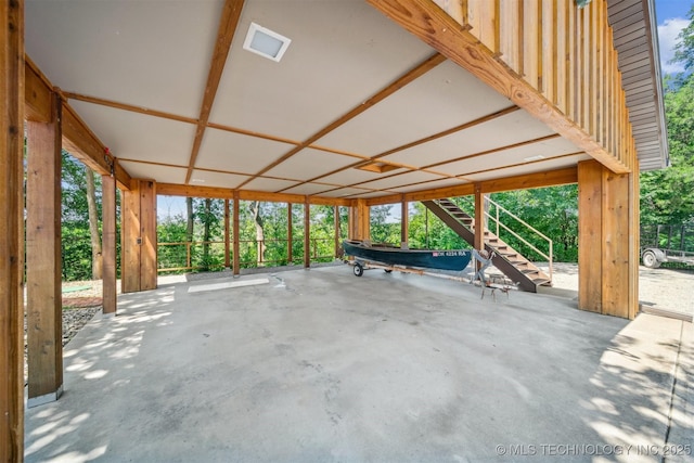 69125 E 252nd Rd, Wyandotte, OK 74370 - view of patio / terrace with stairs, a carport, and view of wooded area