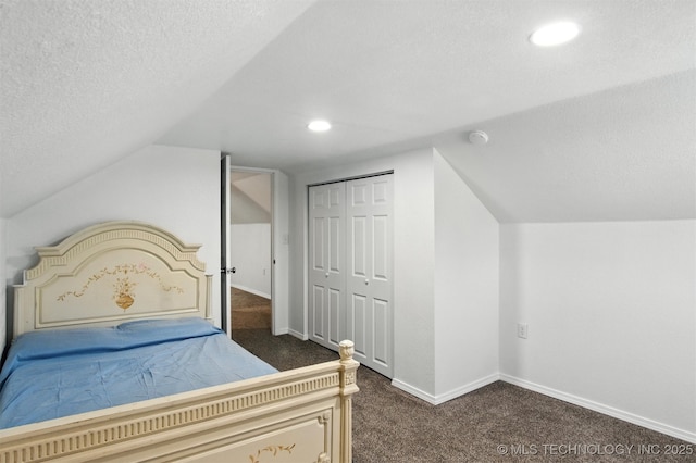 27719 S 610th Rd, Bunch, OK 74931 - bedroom with dark carpet, vaulted ceiling, recessed lighting, a textured ceiling, and a closet