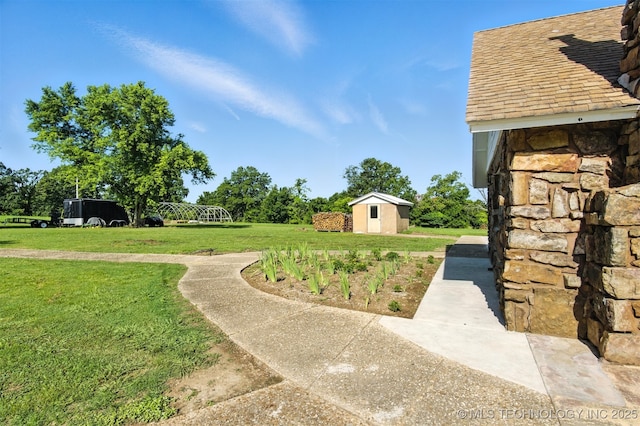 27719 S 610th Rd, Bunch, OK 74931 - view of green lawn with a storage shed