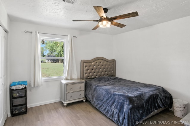 27719 S 610th Rd, Bunch, OK 74931 - bedroom with wood finished floors and a ceiling fan
