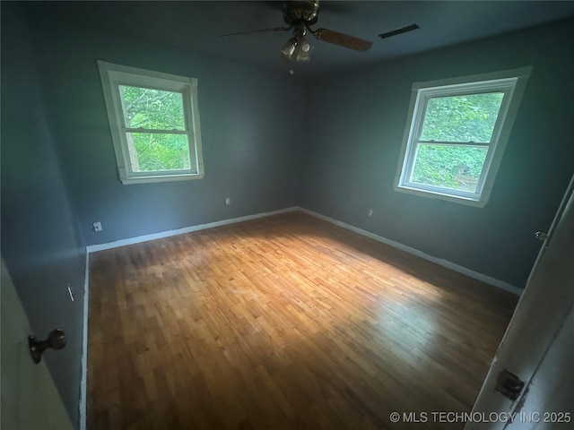 512 S Jules Ave, Cleveland, OK 74020 - spare room with wood finished floors and a ceiling fan