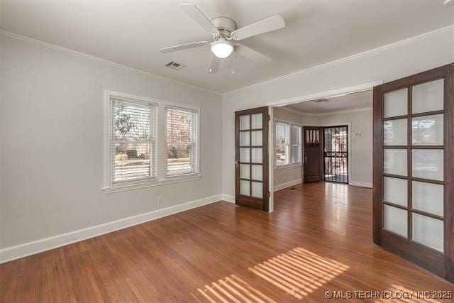 1531 S Florence Ave, Tulsa, OK 74104 - spare room featuring french doors, wood finished floors, ornamental molding, and ceiling fan