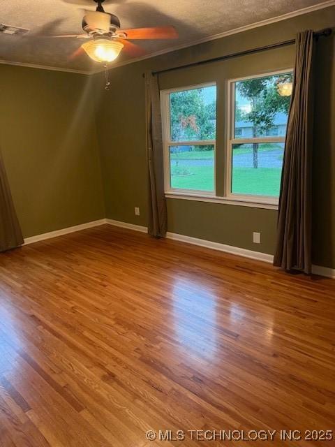 5321 S Owasso Ave, Tulsa, OK 74105 - spare room with ornamental molding, wood finished floors, and ceiling fan
