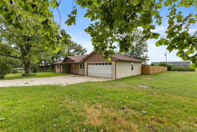 14400 County Road 3490, Ada, OK 74820 - view of front of property with a garage, driveway, board and batten siding, and brick siding