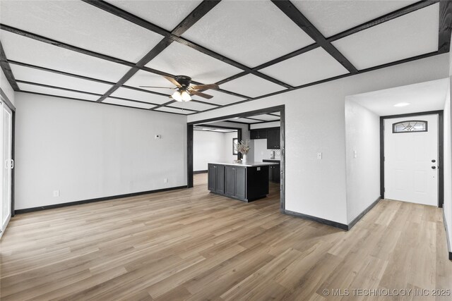 14400 County Road 3490, Ada, OK 74820 - unfurnished living room featuring coffered ceiling, light wood-style floors, and ceiling fan