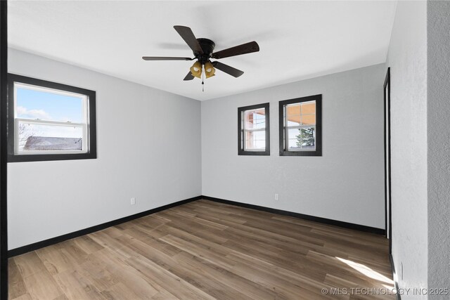 14400 County Road 3490, Ada, OK 74820 - spare room featuring wood finished floors and ceiling fan