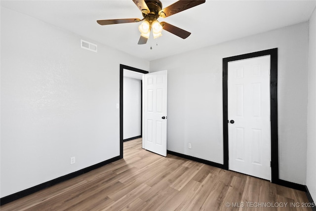 14400 County Road 3490, Ada, OK 74820 - unfurnished bedroom featuring light wood-style floors and a ceiling fan