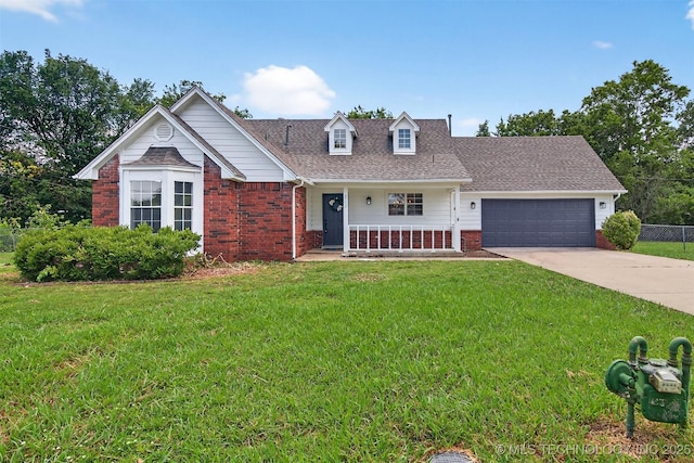 2117 Western Dr, Skiatook, OK 74070 - view of front of home with brick siding, a garage, covered porch, driveway, and a shingled roof