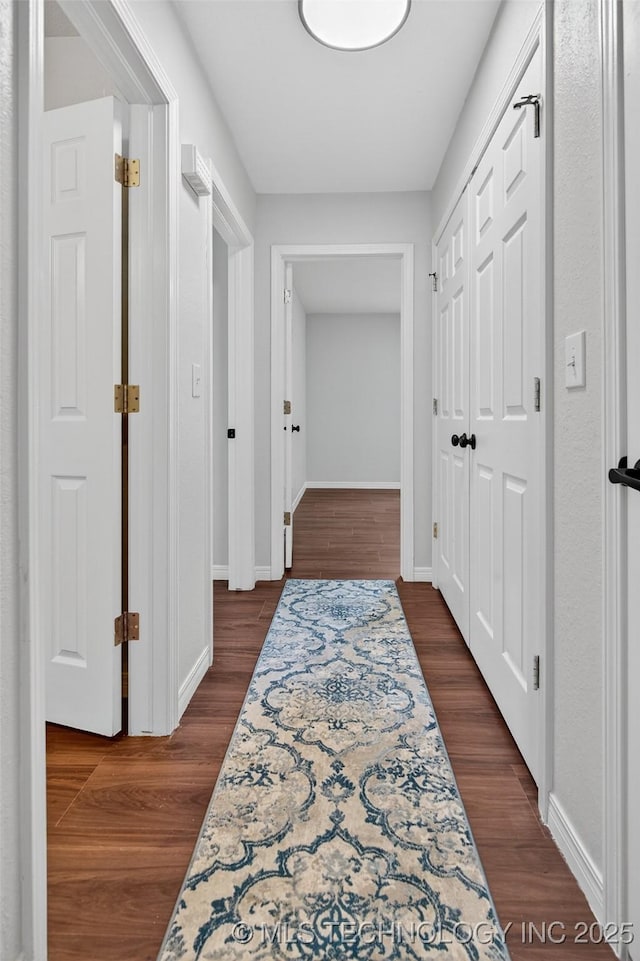 2117 Western Dr, Skiatook, OK 74070 - hallway featuring baseboards and dark wood-style flooring