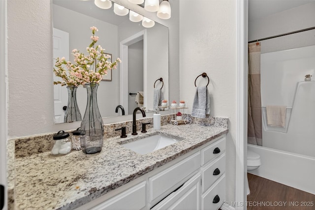 2117 Western Dr, Skiatook, OK 74070 - bathroom featuring vanity, shower / tub combo, and wood finished floors