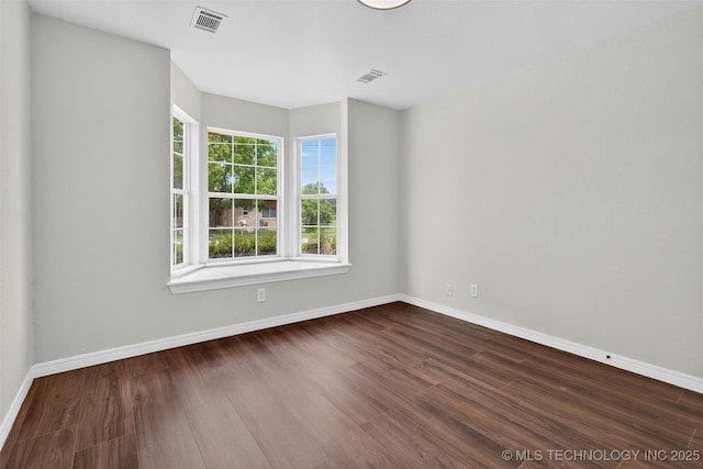 2117 Western Dr, Skiatook, OK 74070 - empty room with dark wood-style floors and baseboards