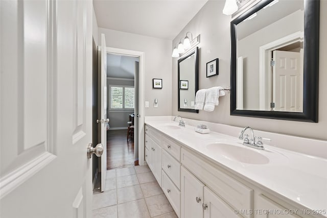 9319 S Indianapolis Ave, Tulsa, OK 74137 - bathroom with double vanity and tile patterned floors