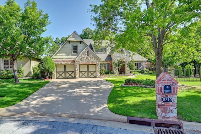 9319 S Indianapolis Ave, Tulsa, OK 74137 - tudor home featuring stone siding, driveway, and an attached garage