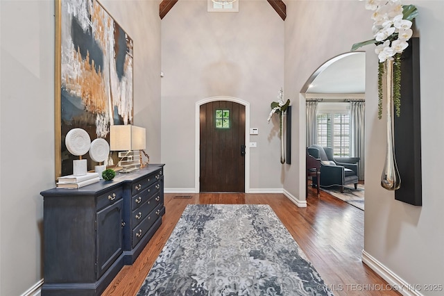 9319 S Indianapolis Ave, Tulsa, OK 74137 - entrance foyer with arched walkways, healthy amount of natural light, wood finished floors, and a towering ceiling