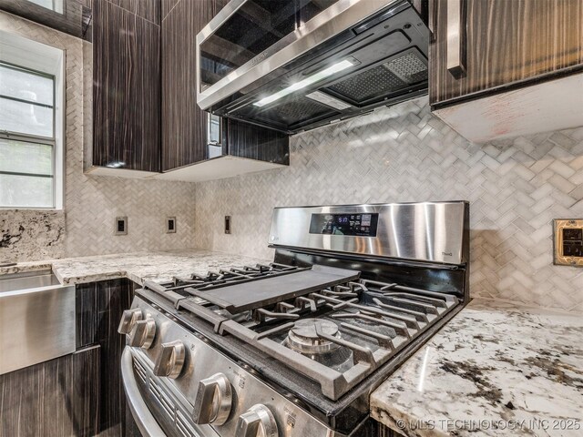 7507 S 92nd E Ave, Tulsa, OK 74133 - kitchen featuring appliances with stainless steel finishes, dark brown cabinetry, and tasteful backsplash