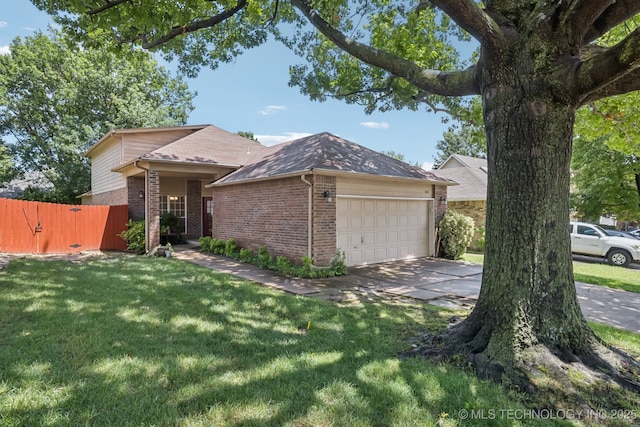 5117 E 89th St, Tulsa, OK 74137 - view of front of home featuring brick siding, a garage, and concrete driveway