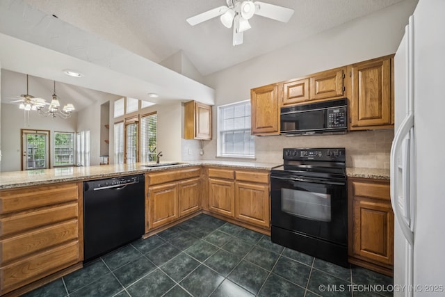 5117 E 89th St, Tulsa, OK 74137 - kitchen featuring black appliances, vaulted ceiling, ceiling fan, decorative backsplash, and a chandelier