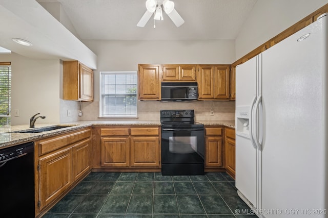 5117 E 89th St, Tulsa, OK 74137 - kitchen with black appliances, decorative backsplash, healthy amount of natural light, and brown cabinets