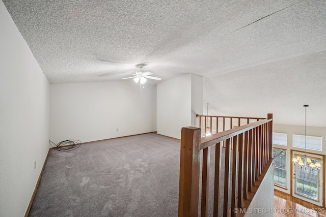 5117 E 89th St, Tulsa, OK 74137 - carpeted spare room featuring ceiling fan, a chandelier, and a textured ceiling