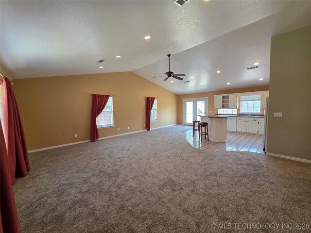 2202 Sycamore Rd, Mcalester, OK 74501 - unfurnished living room with a ceiling fan, light carpet, vaulted ceiling, and recessed lighting