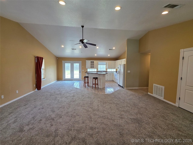 2202 Sycamore Rd, Mcalester, OK 74501 - unfurnished living room featuring light colored carpet, lofted ceiling, ceiling fan, and recessed lighting