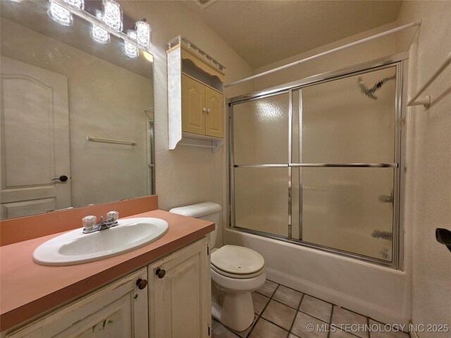 2202 Sycamore Rd, Mcalester, OK 74501 - full bathroom featuring tile patterned floors, vanity, and shower / bath combination with glass door