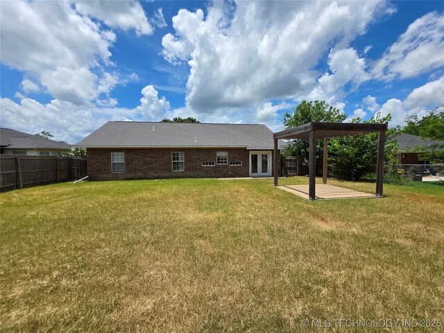 2202 Sycamore Rd, Mcalester, OK 74501 - back of house featuring a patio, a fenced backyard, and french doors