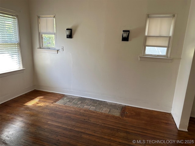 1927 N Cheyenne Ave, Tulsa, OK 74106 - empty room featuring baseboards and hardwood / wood-style flooring