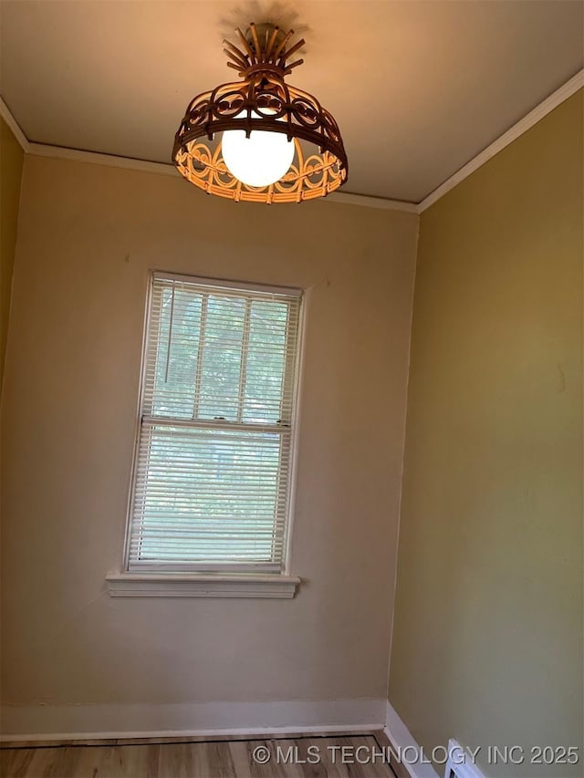 1927 N Cheyenne Ave, Tulsa, OK 74106 - empty room with crown molding and wood finished floors