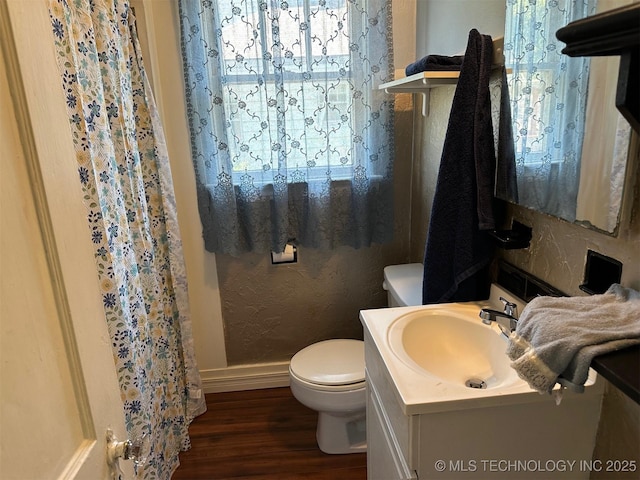 1927 N Cheyenne Ave, Tulsa, OK 74106 - bathroom featuring vanity, wood finished floors, and a shower with shower curtain