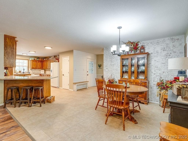 17027 County Road 3547, Ada, OK 74820 - dining room with a chandelier