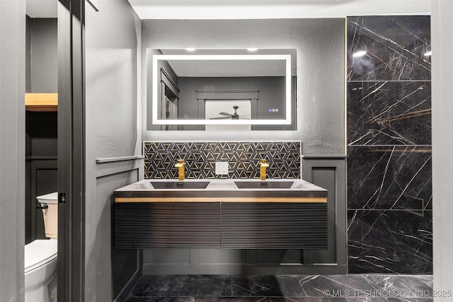16355 County Road 1586, Ada, OK 74820 - bathroom featuring ceiling fan, vanity, and marble finish floors