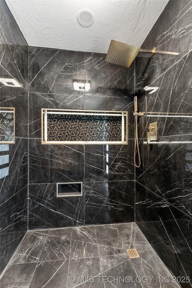 16355 County Road 1586, Ada, OK 74820 - full bath featuring a textured ceiling, a marble finish shower, and marble look tile flooring