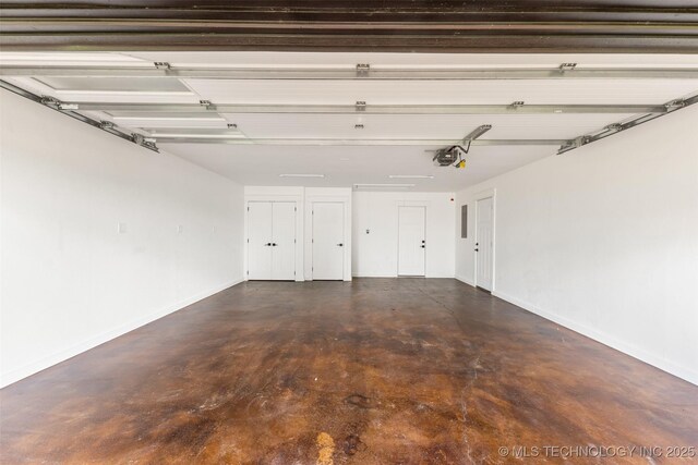 16355 County Road 1586, Ada, OK 74820 - garage featuring baseboards and a garage door opener
