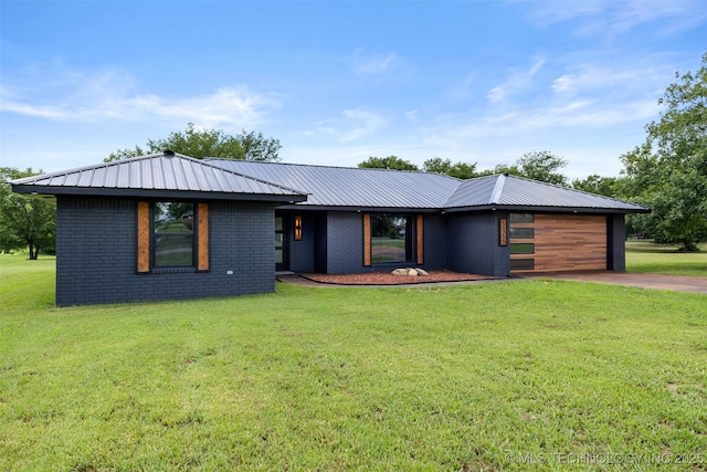16355 County Road 1586, Ada, OK 74820 - view of front facade featuring driveway, a front yard, and a metal roof