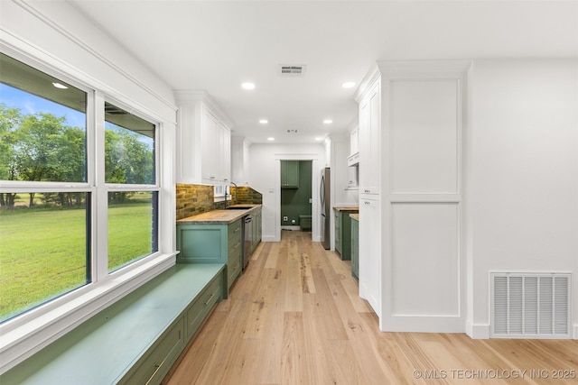 16355 County Road 1586, Ada, OK 74820 - corridor featuring plenty of natural light, light wood-style flooring, and recessed lighting