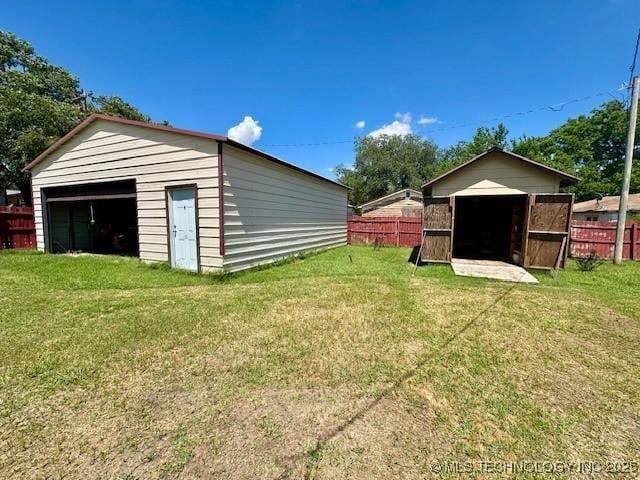 131 S Hyden, Stratford, OK 74872 - view of yard featuring a detached garage and an outdoor structure
