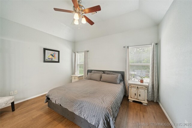 21700 S Calen Dr, Claremore, OK 74019 - bedroom with wood finished floors, vaulted ceiling, and ceiling fan