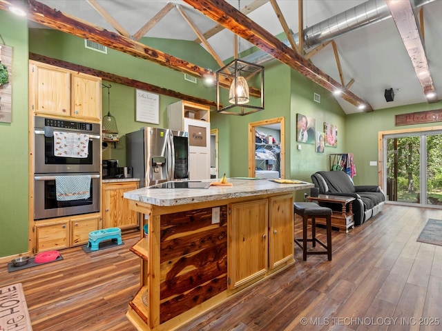 346 2570th Rd, Bartlesville, OK 74003 - kitchen featuring stainless steel appliances, dark wood finished floors, a center island, light countertops, and beamed ceiling