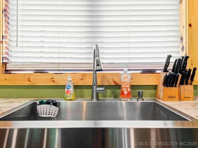 346 2570th Rd, Bartlesville, OK 74003 - kitchen view of a sink and light stone counters