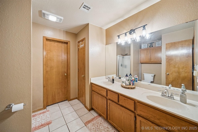 2 Ketchum St, Chelsea, OK 74016 - full bathroom with a textured wall, double vanity, tile patterned flooring, and a shower