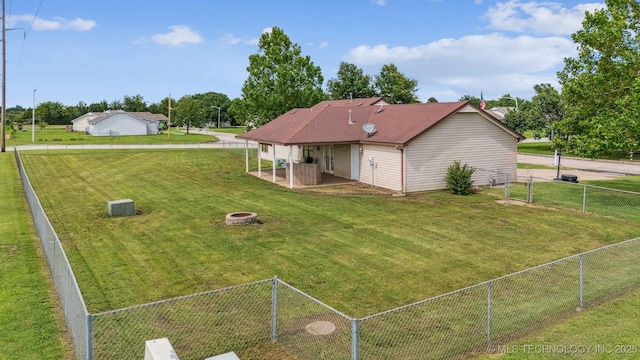 2 Ketchum St, Chelsea, OK 74016 - fenced backyard featuring a fire pit