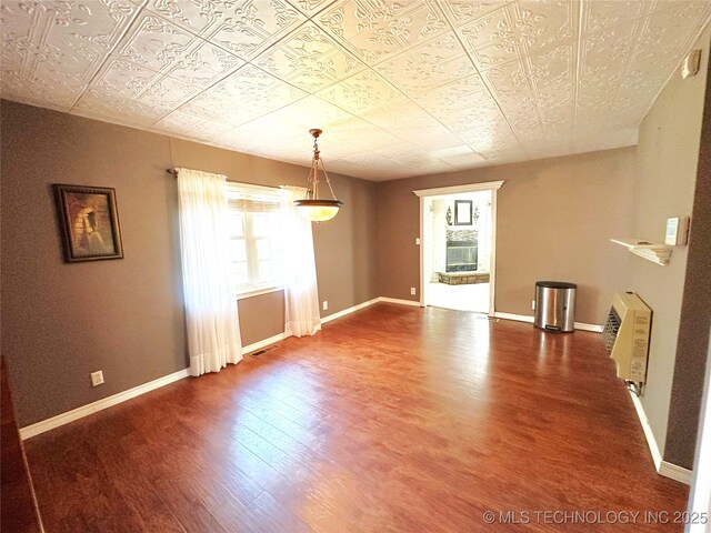 5371 Hilltop, Mcalester, OK 74501 - unfurnished room with wood finished floors and an ornate ceiling