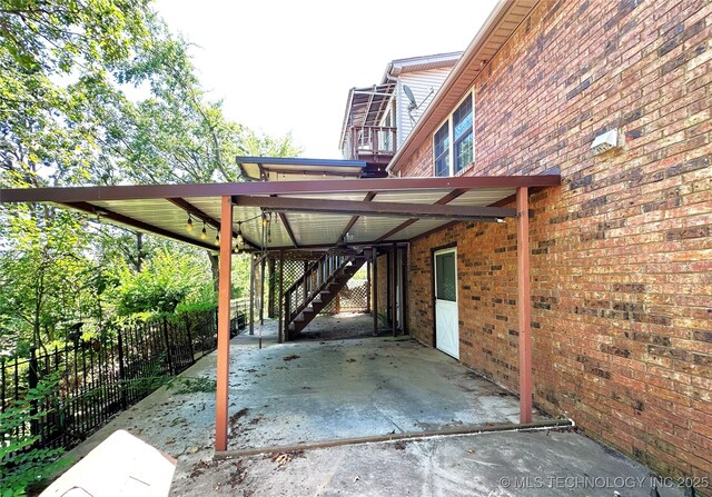5371 Hilltop, Mcalester, OK 74501 - view of patio with stairs and an attached carport