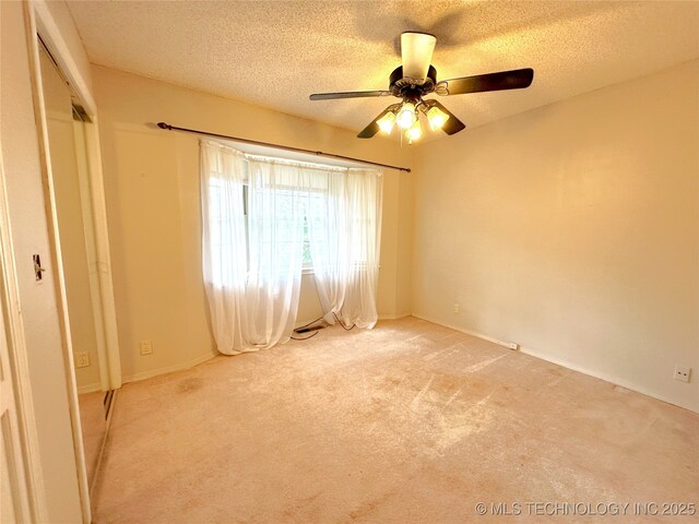 5371 Hilltop, Mcalester, OK 74501 - unfurnished bedroom with carpet flooring, a textured ceiling, a ceiling fan, and a closet