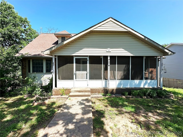 5371 Hilltop, Mcalester, OK 74501 - bungalow-style house featuring a sunroom and a shingled roof